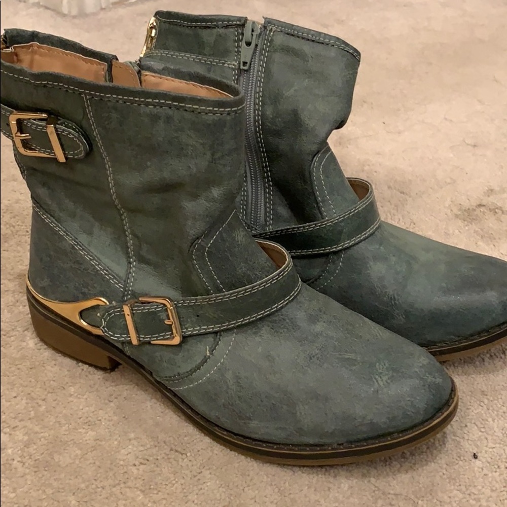 Green boots with gold hardware